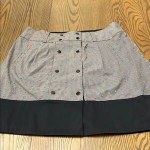 Carlisle Black and White Mini Skirt with Orange Dot Accents